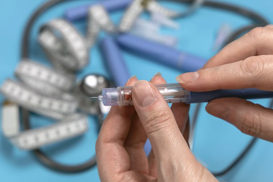 a hand holding a semaglutide pen